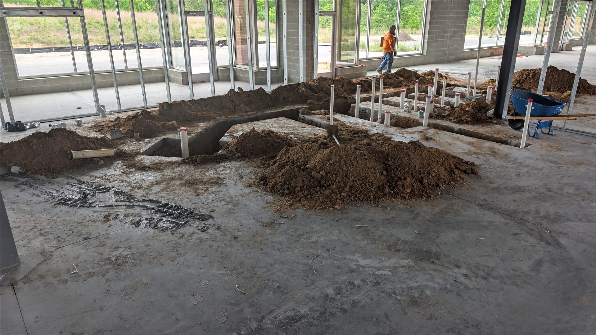 Plumbing rough-in inside a commercial interior.