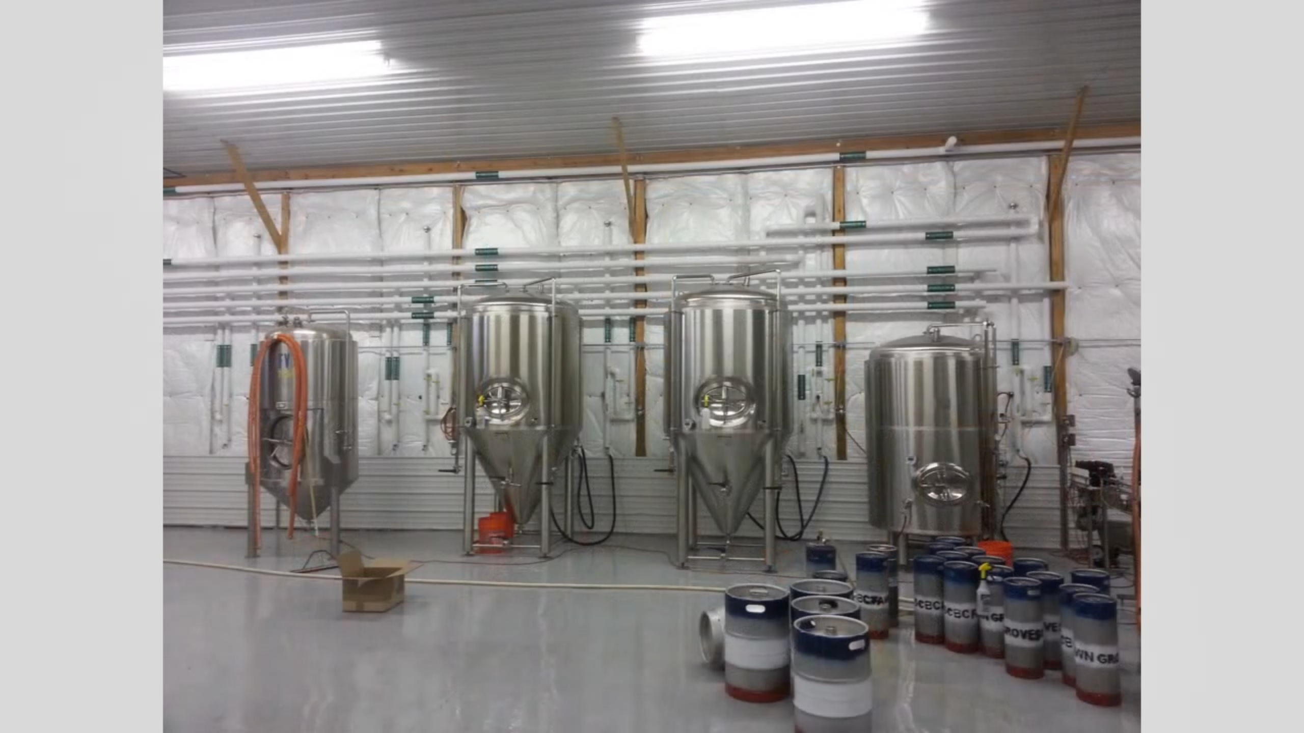Chiller and brewery tank area with process piping