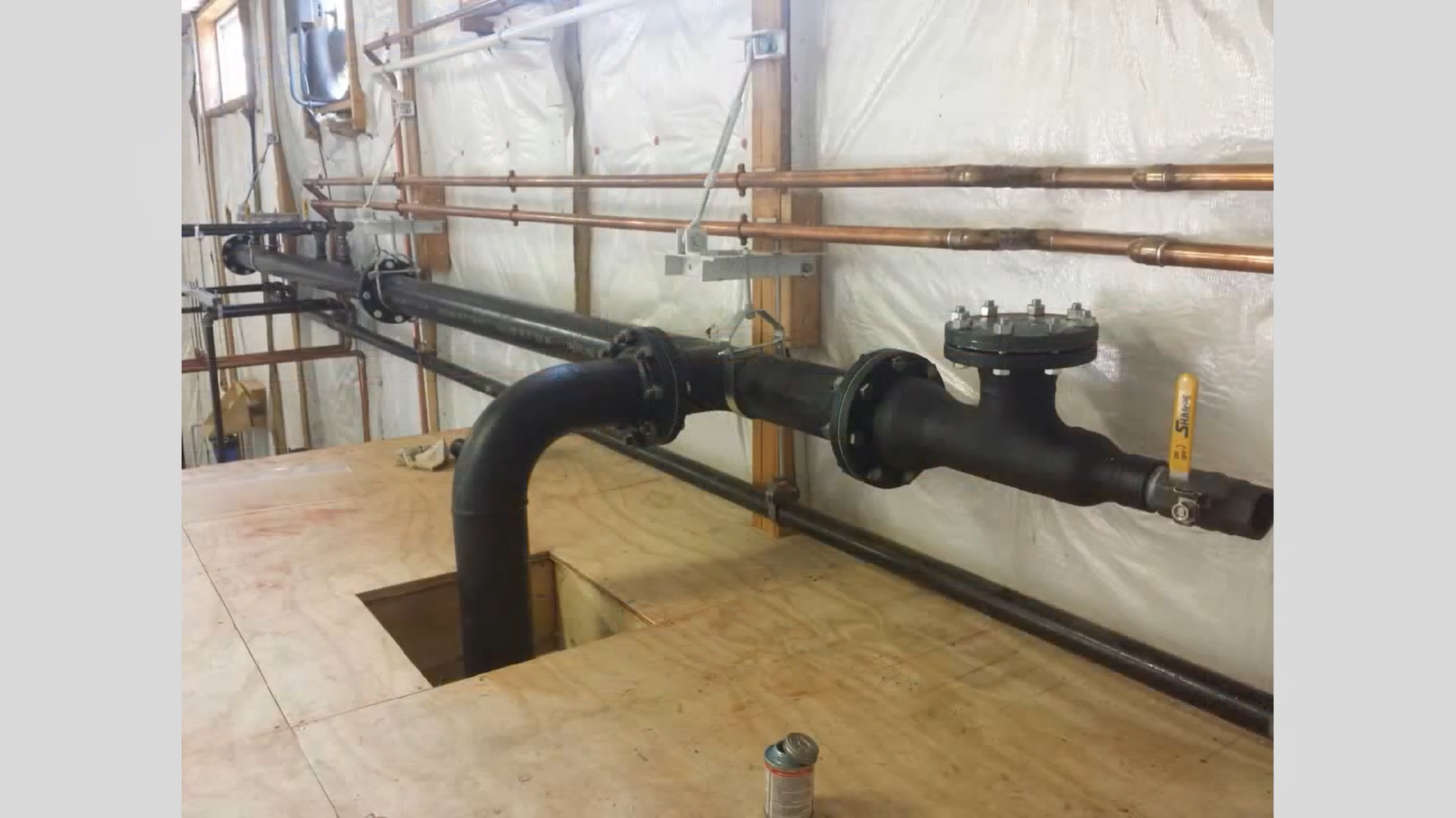 Steam condensate and process-related piping in a brewery space